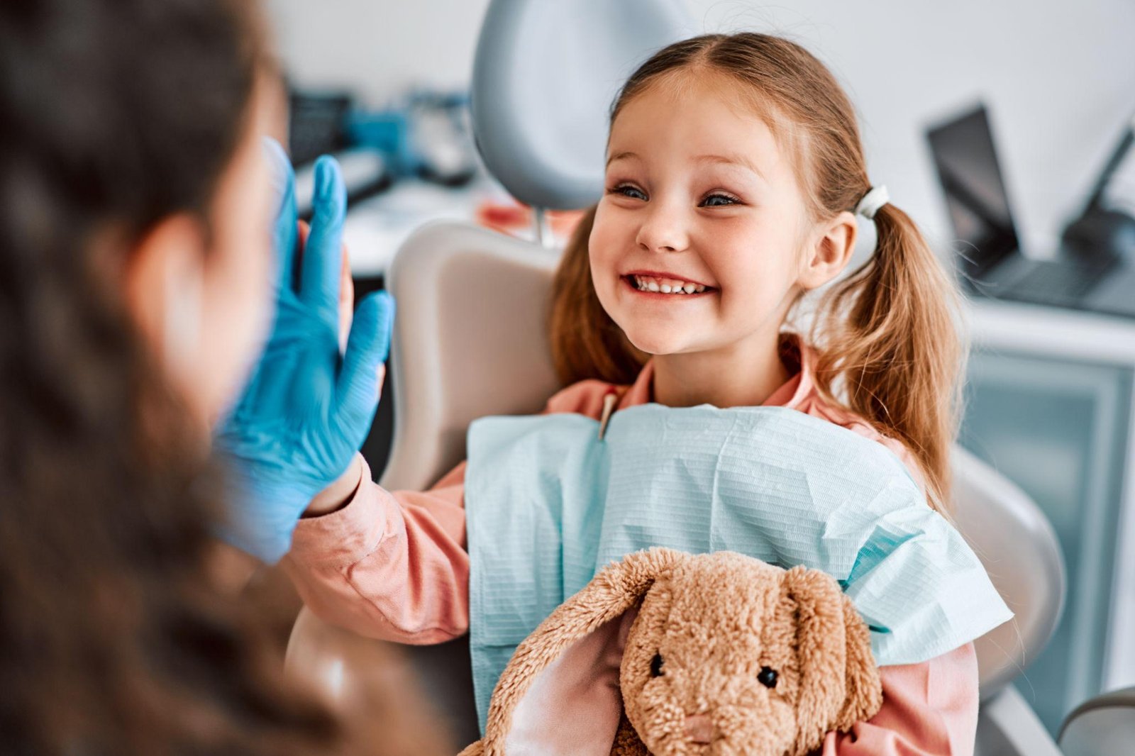 Kid smiling at dental clinic